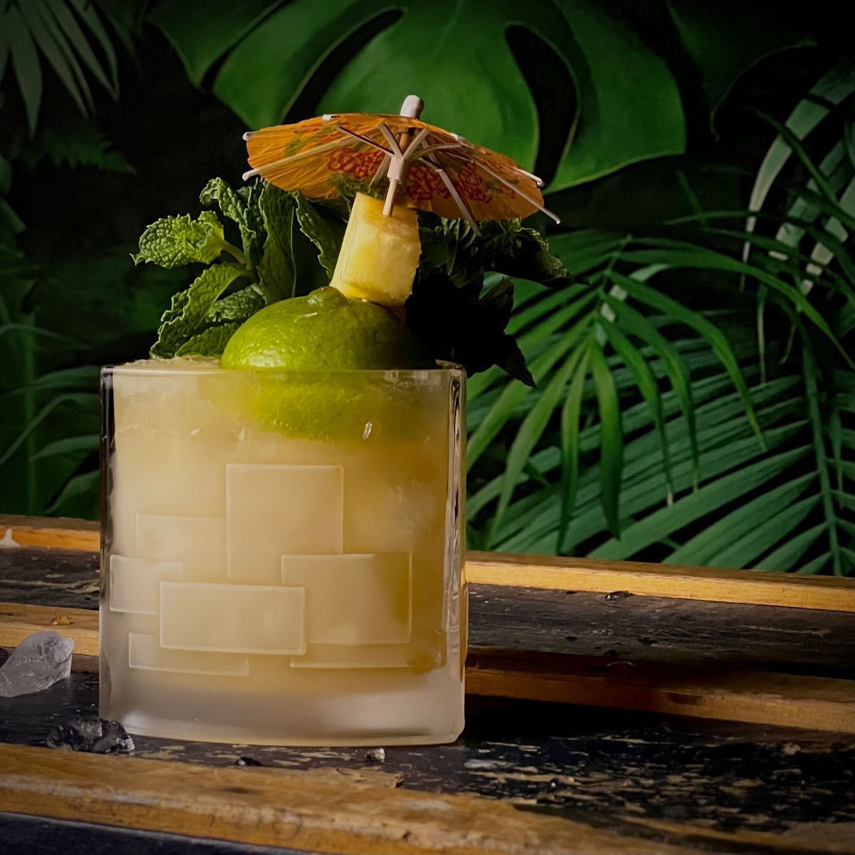This week’s entry from the Minimalist Tiki Classic Thirty is the Royal Hawaiian Mai Tai—the missing link between the perfect original and the abominations served in bars across the world sharing nothing but the name.

For my modern reimagining, I wanted to jam all of the extra flavours the RH Mai Tai’s 6.5 ounce monster volume in the template of the classic. To achieve this without adding all the extra juices, I made a fantastic syrup with pineapple and citrus peels to capture all those delicious aromatics.

Since that syrup has so much extra tartness from the aforementioned citrus, I dialed the lime juice back just a touch from the usual ounce I’d use in a Mai Tai. Otherwise, the build is very familiar.

My first thought for the name was something related to Kamehameha, the first King of the Hawaiian Islands (the first Royal Hawaiian, ha ha ha), but I figured—correctly—that there were already cocktails named for him. I did some research, and learned that he was known as Paiea when he was born. 

Recommended Brands:
•Appleton Estate Rare Casks 12
•El Dorado 8 Year
•Flor de Caña Extra Dry 4 Year
•Pierre Ferrand Dry Curaçao

ROYAL HAWAIIAN OLEO:

•1 1/2 cup chopped pineapple
•peel of one lemon, chopped
•peel of one lime, chopped
•peel of one large orange, chopped
•sugar (approx 375g)

Combine pineapple and peels in a large bowl. Weigh it, and cover with an equal amount of sugar by weight. Stir to combine. Cover and let rest for up to 24 hours, stirring regularly, until all sugar has dissolved. Strain and bottle.
