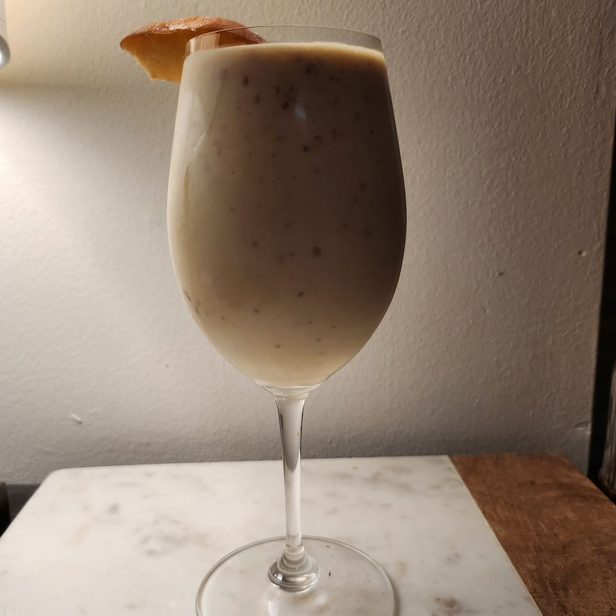 Hello friends! I'm back again with another frozen peach cocktail! This time I have rum and coconut cream for a version of a colada with peach in it. This time, the coconut cream gives the drink a wonderful body and the fresh peach lends a delicate flavor. This is a great summertime drink, and with the weather still being quite warm, this was a perfect little sipper. All in all, this was a great drink! Cheers!