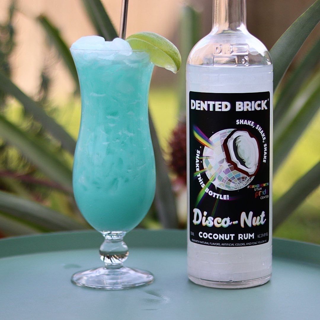 A riff on a Blue Hawaiian with a sparkly twist! Dented Brick Disco-Nut coconut rum is coco-nutty with tons of fun sparkles, watching them swirl around the bottle is mesmerizing. I wanted a tropical cocktail today. 
A. Because it’s #tikituesday 
and 
B. Because it’s hot as hell here and nothing sounded better than a tropical cocktail. 