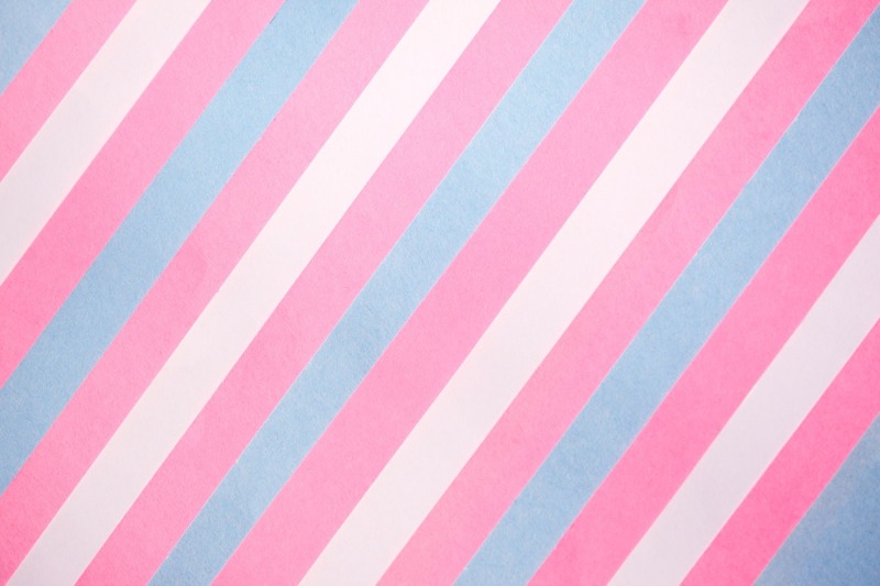 Diagonal pink, white and blue stripes in the colours of the transgender pride flag