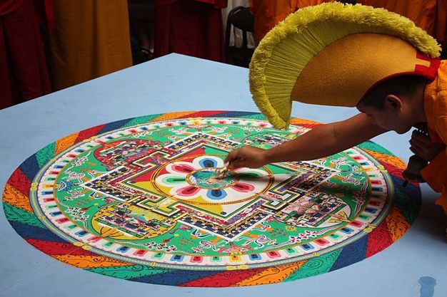 Mandala zel-tary using Vajra to ceremoniously divide the painting