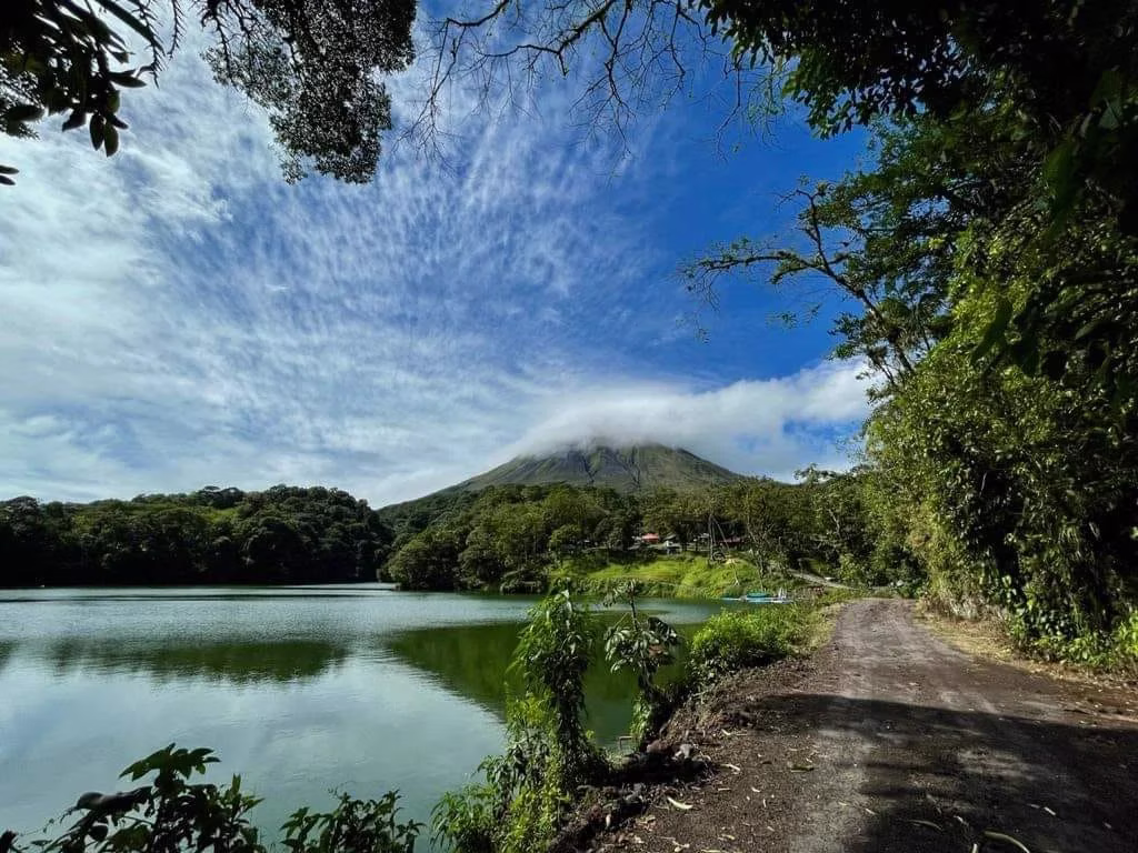 Trail running alongside a lagoon in Arenal