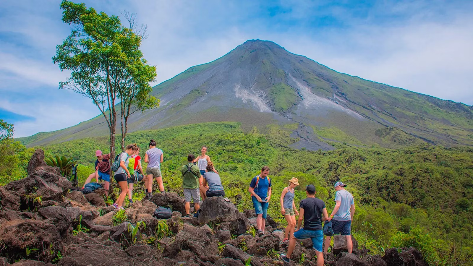People hiking up Arenal Volcano in Costa Rica