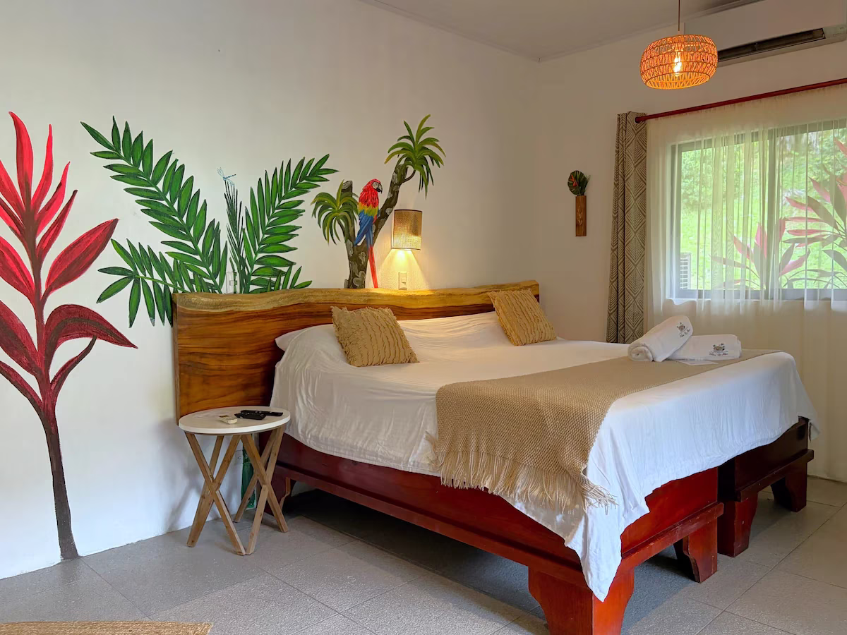 Standard King Room at Villas Río Mar in Dominical, Costa Rica, featuring a comfortable setting surrounded by nature