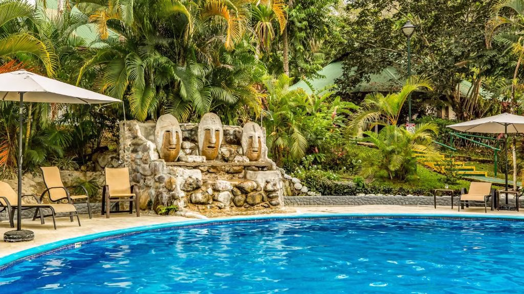 Pool fountain with indigenous inspired design at Villas Río Mar in Dominical, Costa Rica