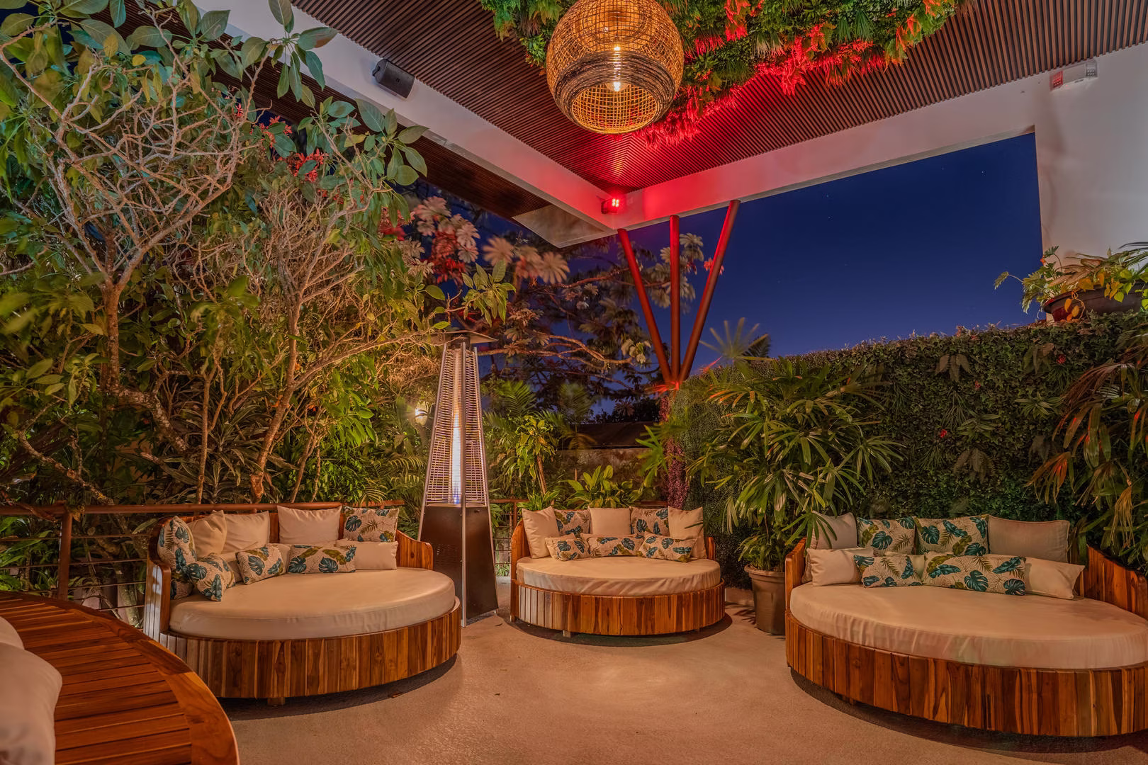 Night pool lounge area with heating at Sibu Boutique Hotel