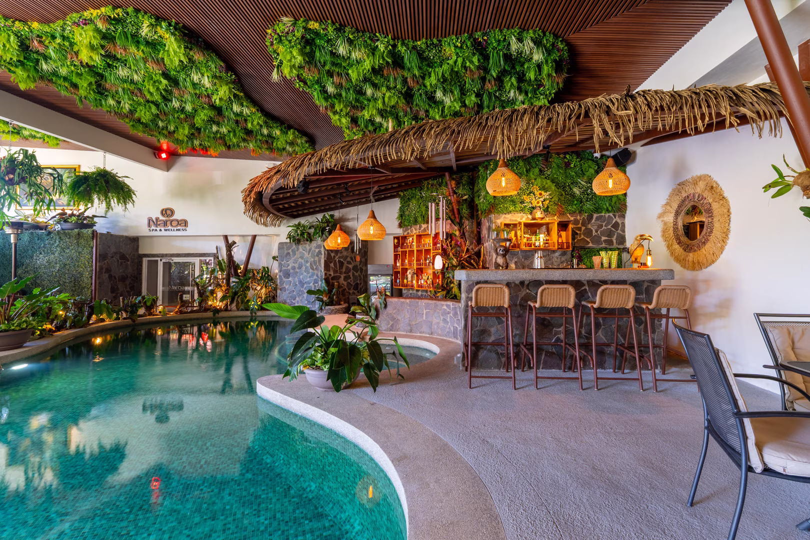 Indoor pool with bar seating at Sibu Boutique Hotel in Monteverde