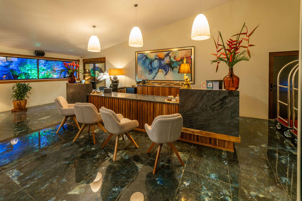 Lobby lounge view featuring the main reception desk and seating area at Hotel & Spa Poco a Poco, Monteverde