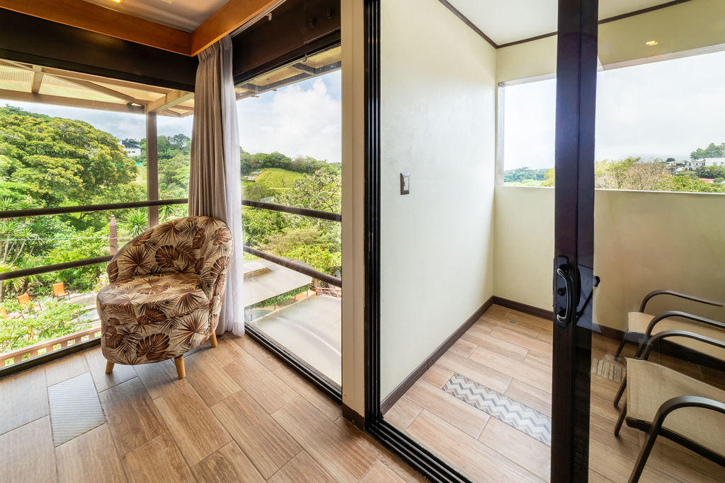 Balcony view of Quetzal Room overlooking the natural surroundings at Hotel & Spa Poco a Poco, Monteverde
