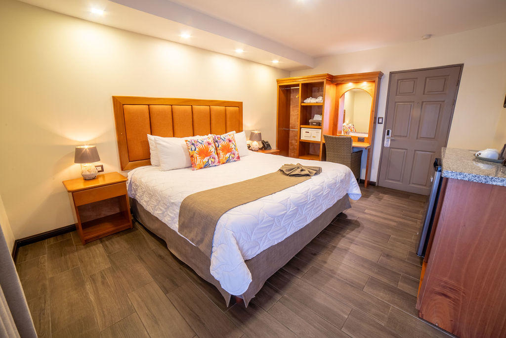 Quetzal Room corner view featuring a king bed and cozy interior design at Hotel & Spa Poco a Poco, Monteverde