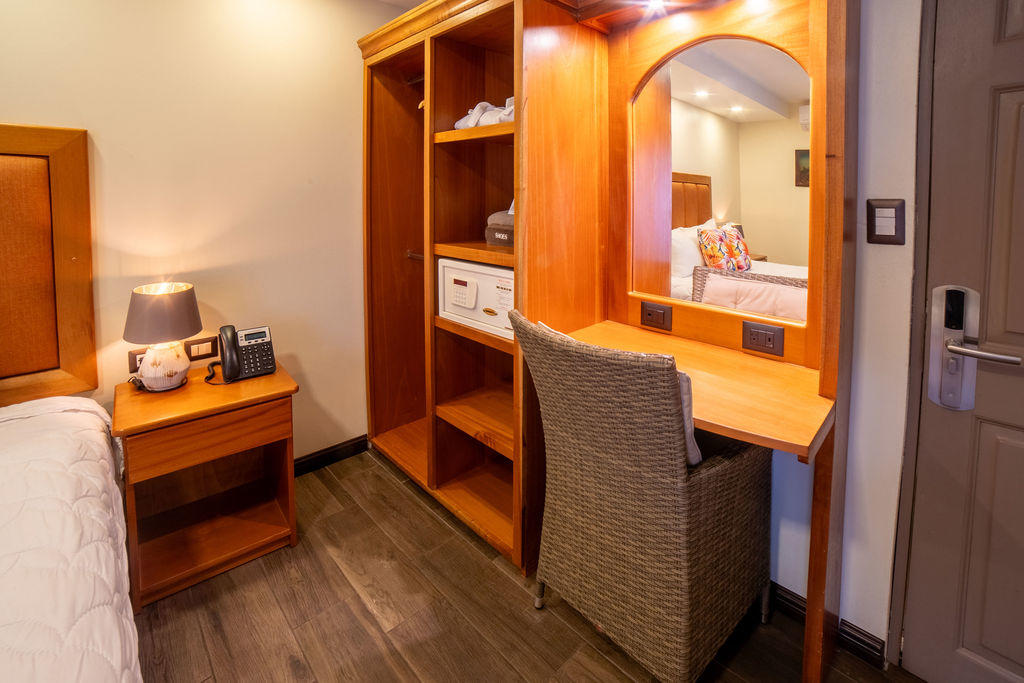 Comfortable vanity area for women next to a wardrobe in Quetzal Room at Hotel & Spa Poco a Poco, Monteverde