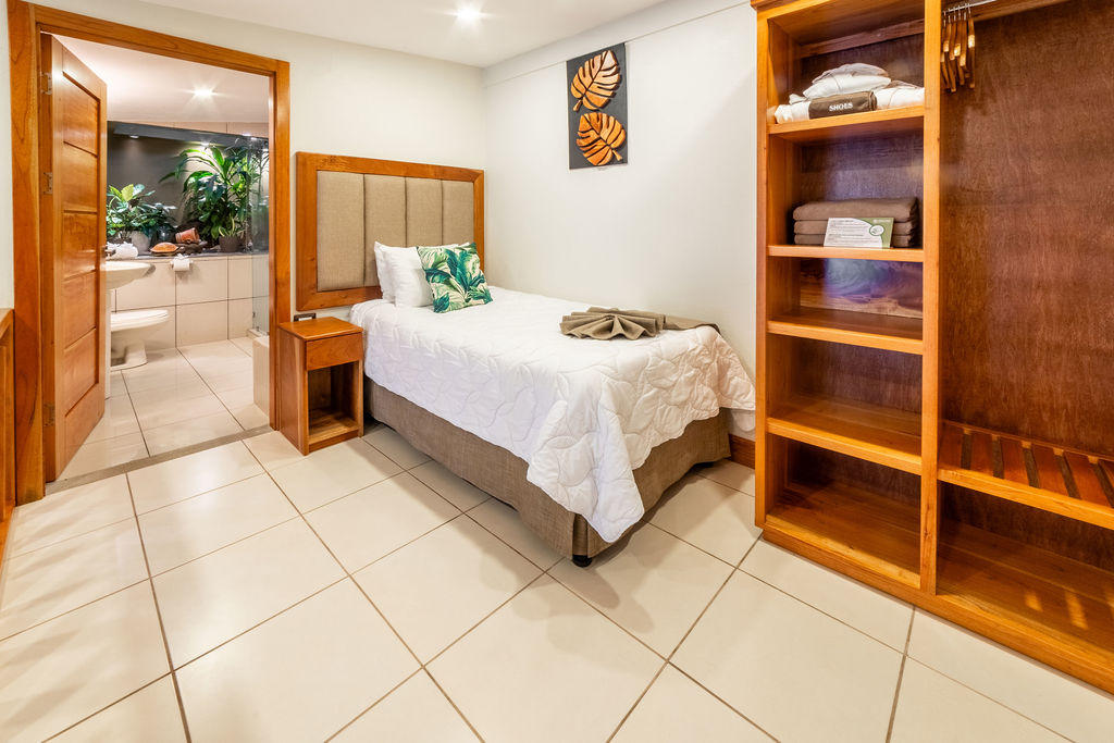 Upper level view of Garden Family Room with single bed and closet area at Hotel & Spa Poco a Poco, Monteverde