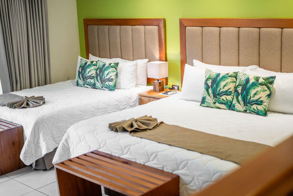 Garden Family Room featuring a king bed and a queen bed in a spacious layout at Hotel & Spa Poco a Poco, Monteverde