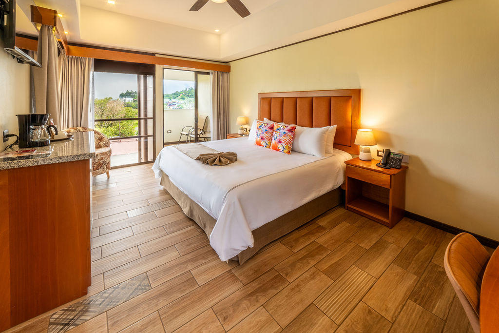 Alternate view of Quetzal Room featuring a king bed and modern interior design at Hotel & Spa Poco a Poco, Monteverde