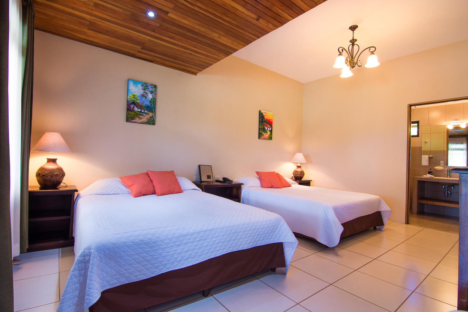 Superior room with two queen beds, spacious layout and natural light at Monteverde Country Lodge, Monteverde, Costa Rica