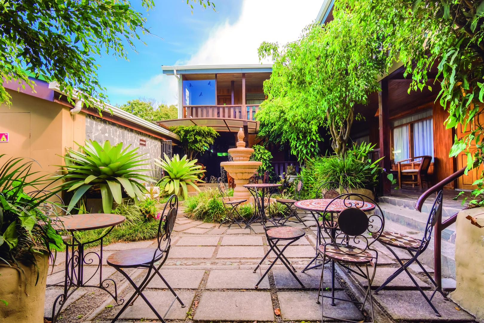 Elegant inner courtyards with seating areas and access paths to rooms at Monteverde Country Lodge, Monteverde, Costa Rica