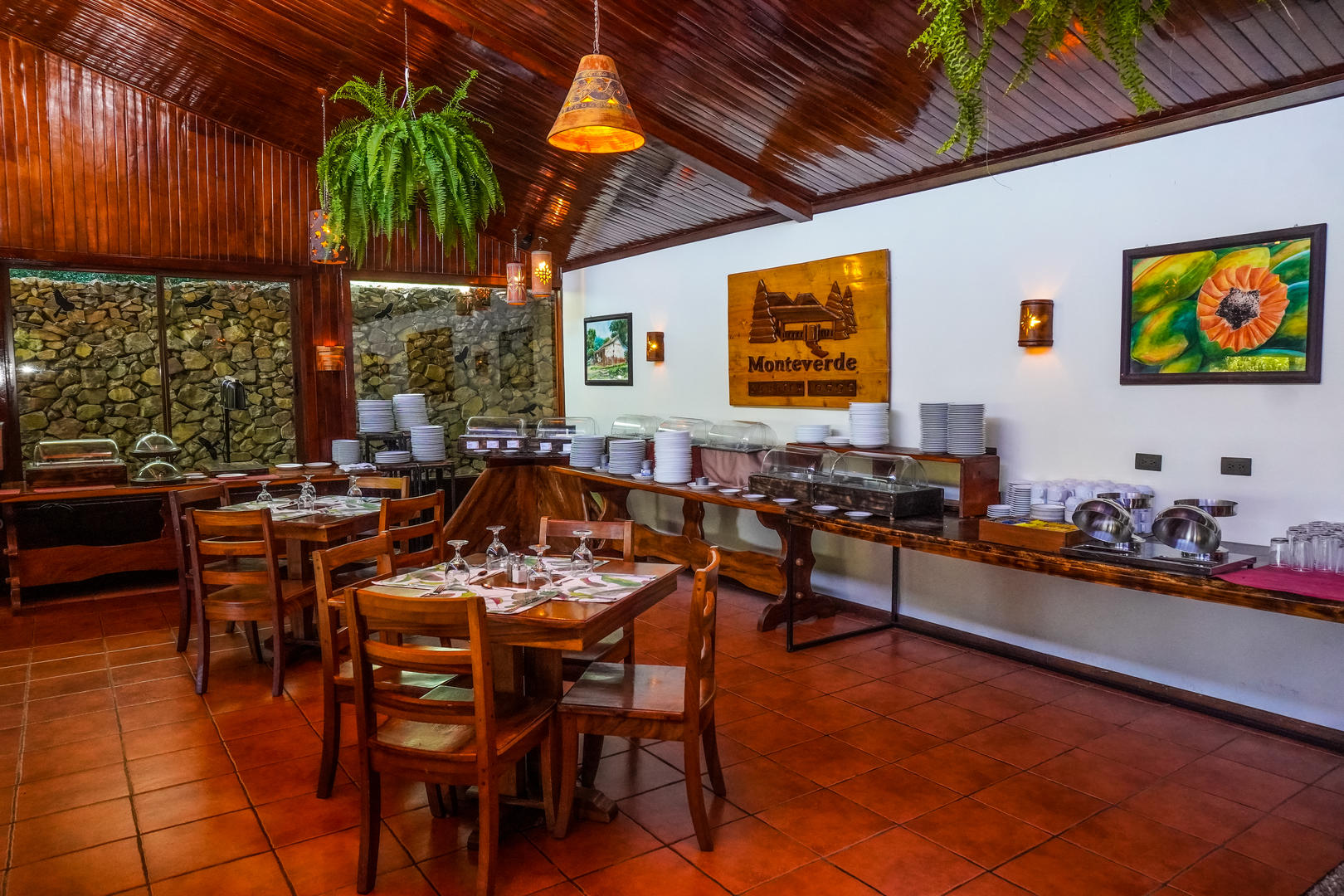 Restaurant Fontana dining area with tables and breakfast buffet in the background at Monteverde Country Lodge, Monteverde, Costa Rica