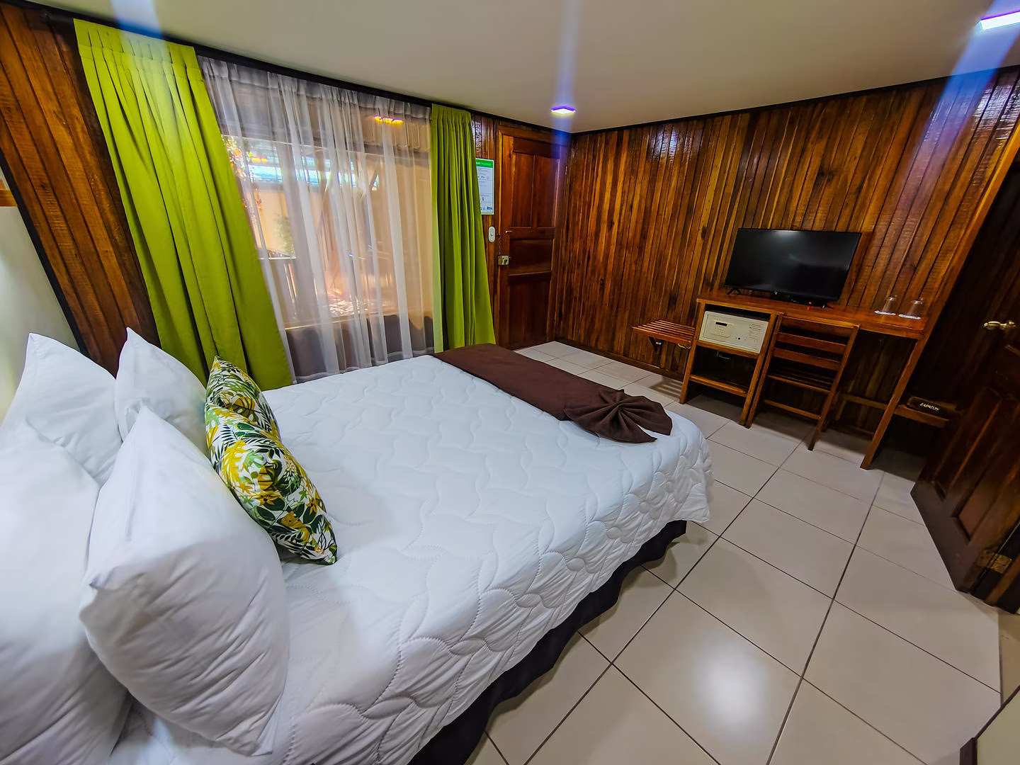 Classic room with one queen bed for two guests at Monteverde Country Lodge in Monteverde, Costa Rica