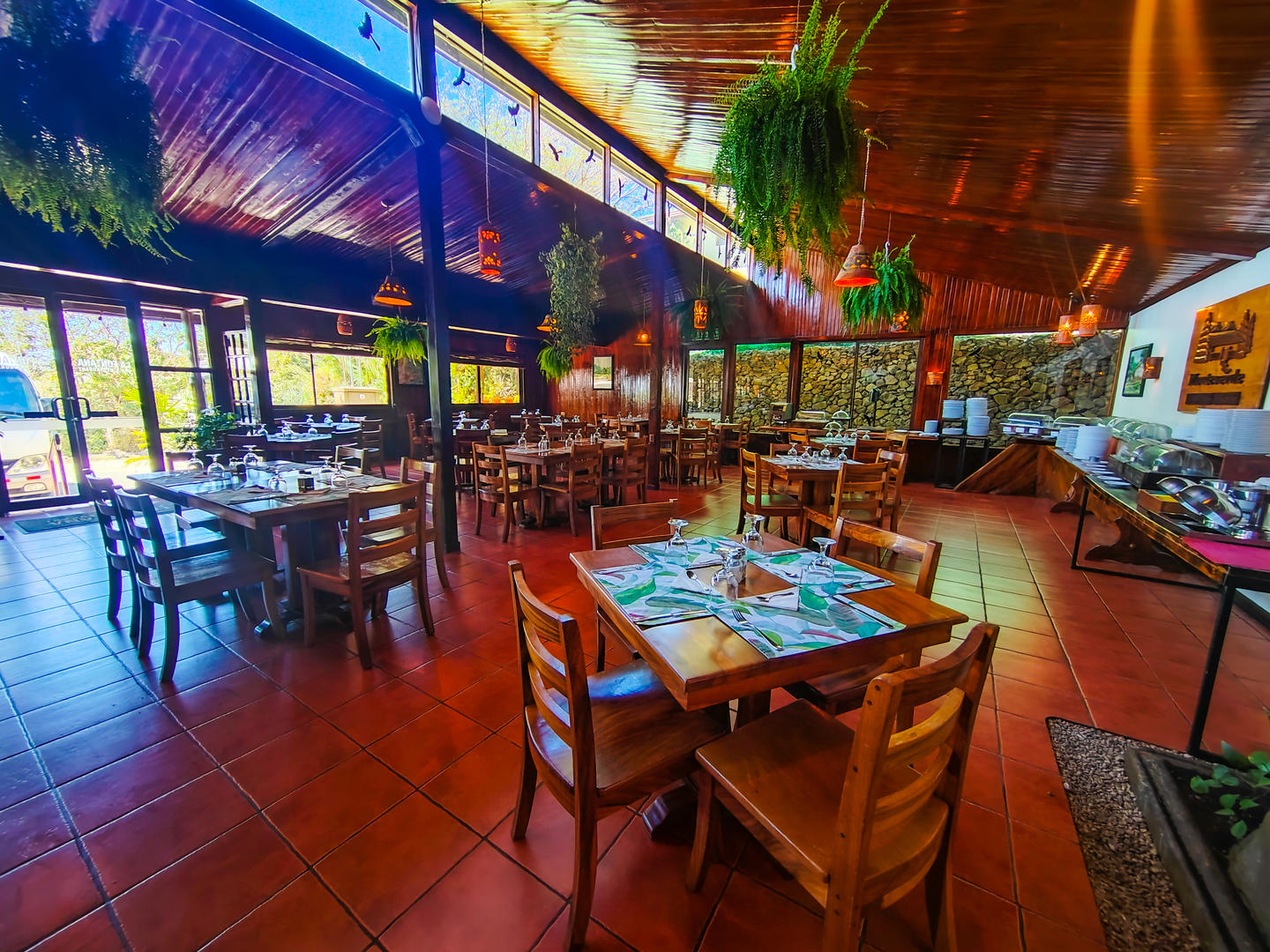 Restaurant Fontana dining tables in a warm and inviting setting at Monteverde Country Lodge, Monteverde, Costa Rica