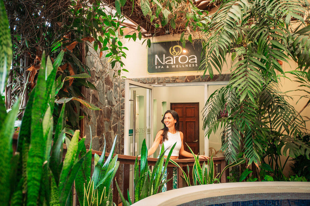 Woman entering the main access of Naroa Spa and wellness area at Monteverde Country Lodge, Monteverde, Costa Rica