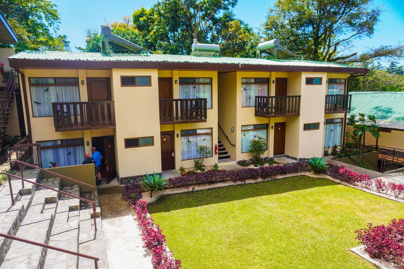 Aerial view of multiple two story accommodation buildings with lush gardens at Monteverde Country Lodge, Monteverde, Costa Rica