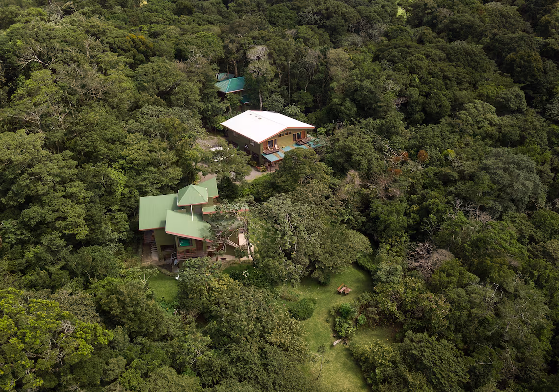 Aerial view of Cala Lodge hotel surrounded by mountains