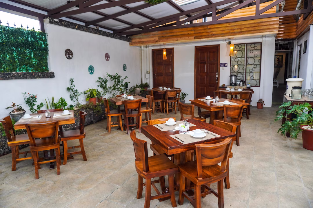 Dining area with tables for meals at La Fortuna Lodge, La Fortuna, Costa Rica
