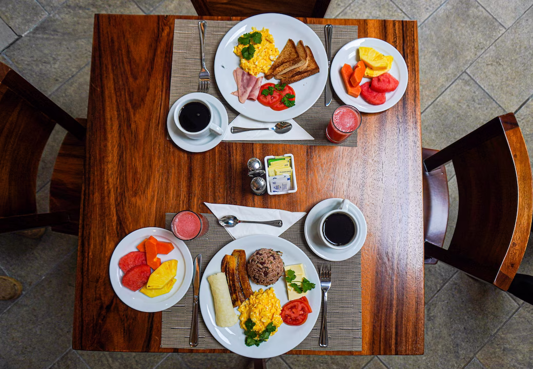 Top down view of a table set with traditional Costa Rican breakfast at La Fortuna Lodge, La Fortuna, Costa Rica