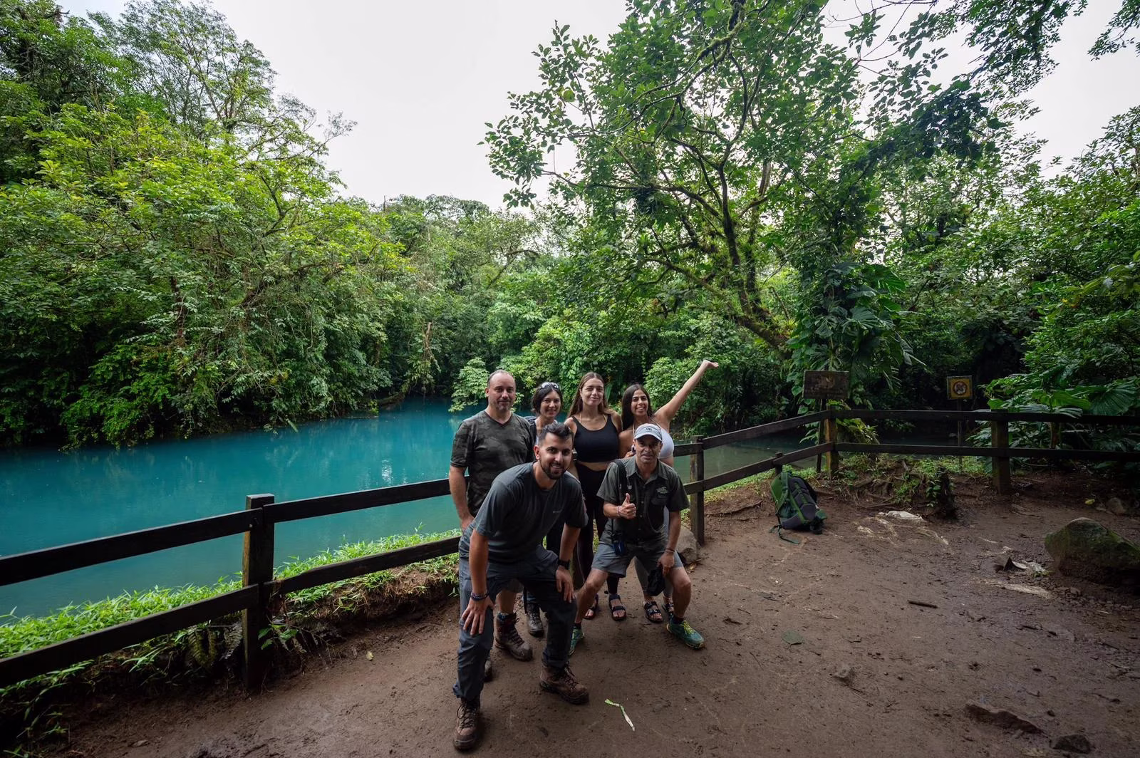 Group of tourists taking photos at Río Celeste viewpoint