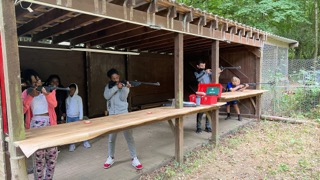 Young people shooting air rifles