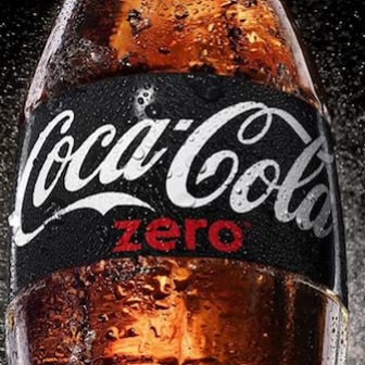 Coca Cola Zero bottle with dark background and a splash of mist.