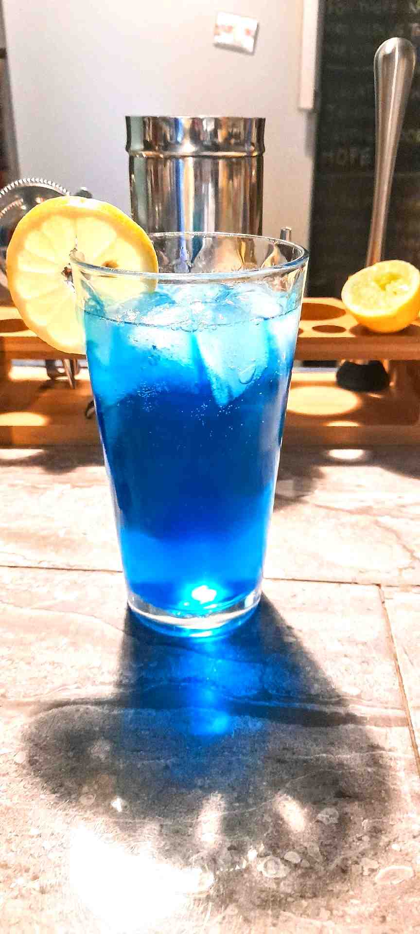 Community photo of a Blue Lagoon cocktail: A tropical looking cocktail that pleases everyone. Bitter in flavour with floral notes though refreshing. Rum makes a more tropical alternative to vodka.