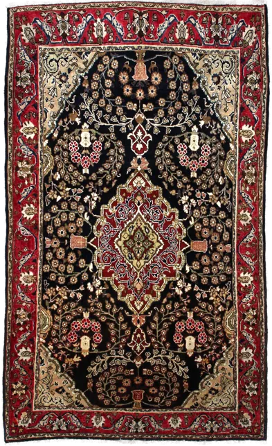 Handmade Persian rug in dimensions 183 centimeters length by 112 centimetres width with mainly Red and Black colors
