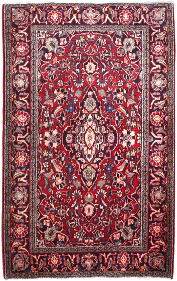 Handmade Persian rug of Vintage style in dimensions 200 centimeters length by 125 centimetres width with mainly Red colors