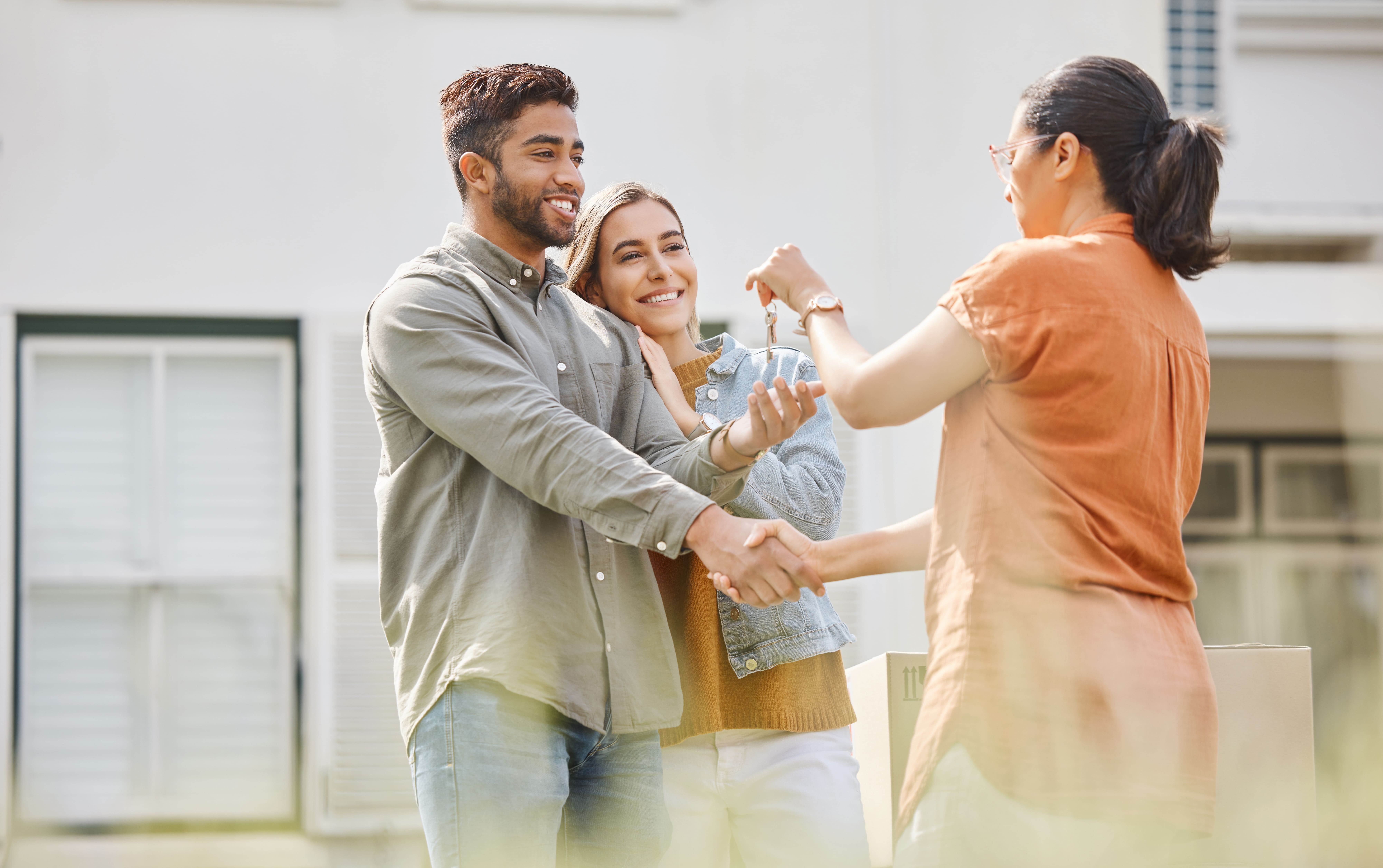 house-key-realtor-woman-and-handshake-with-couple-2026-01-09-10-03-09-utc house-key-realtor-woman-and-handshake-with-couple-2026-01-09-10-03-09-utc