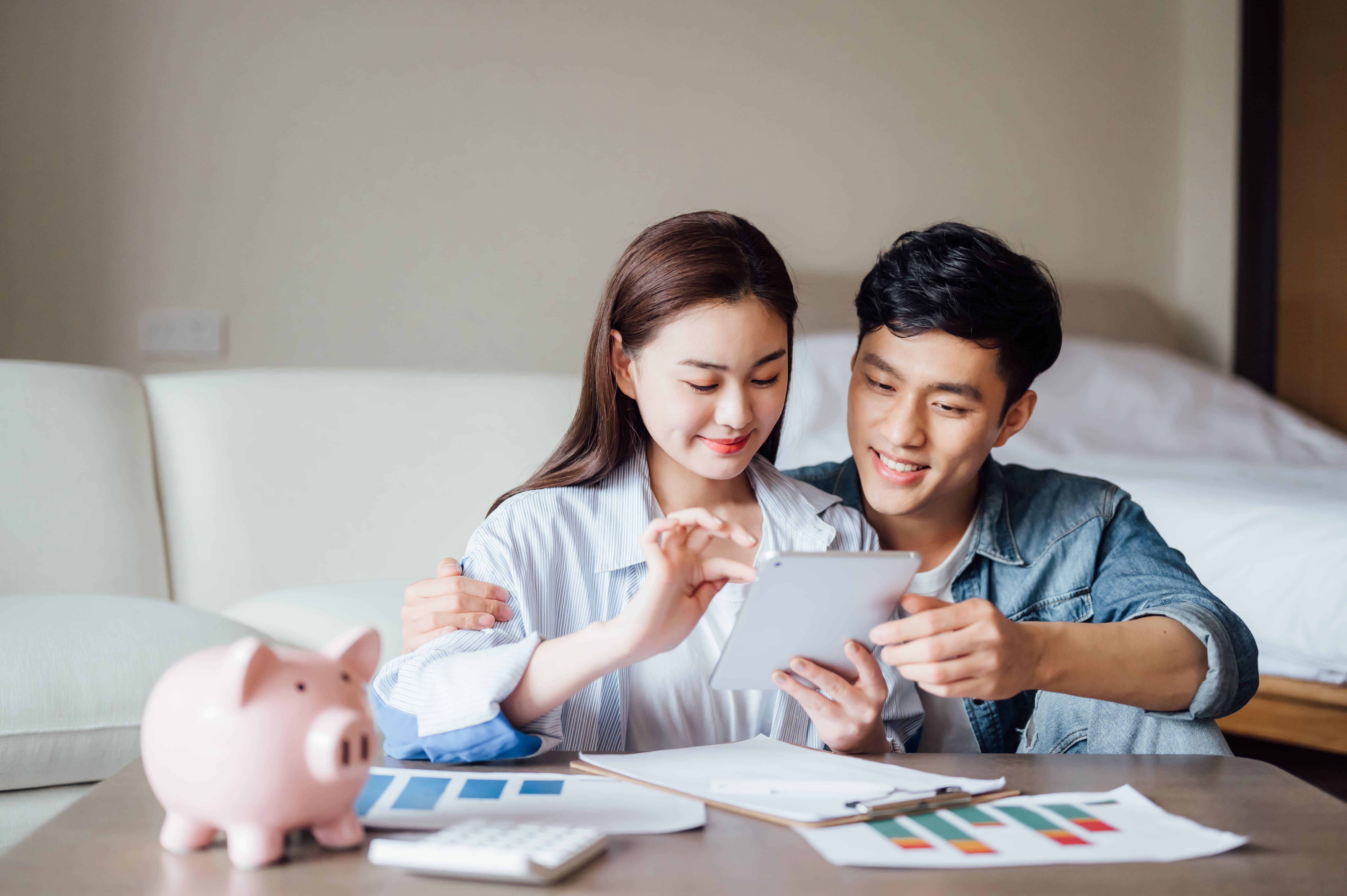 smiling-couple-plans-savings-together-in-home-sett-2026-09-24-00-08-19-utc (1)