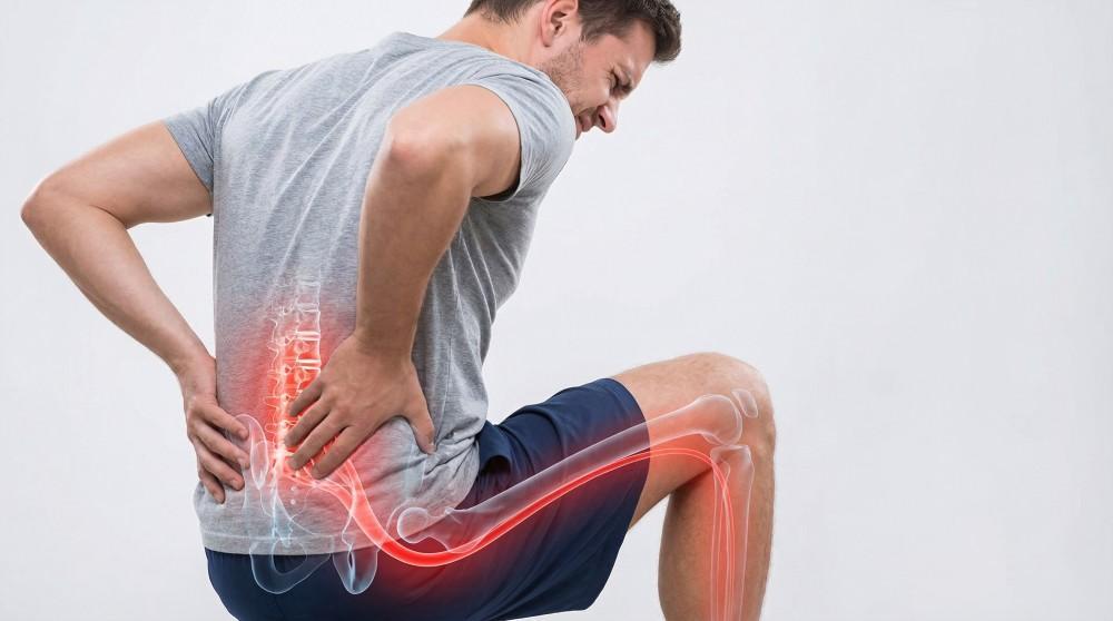 Physiotherapist assessing sciatica-related leg pain in Brampton