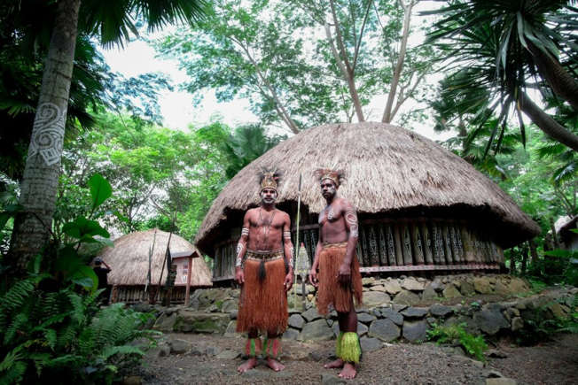 Indigenous tribesmen in the middle of a rainforest