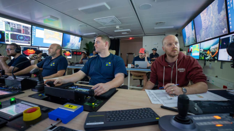 At far right are Dr. John Jamieson and Charles Lapointe (behind in a red hat) in the remotely operated vehicle control room.