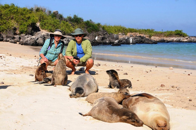 Tourists with sea lions | Galapagos Islands | Ecuador