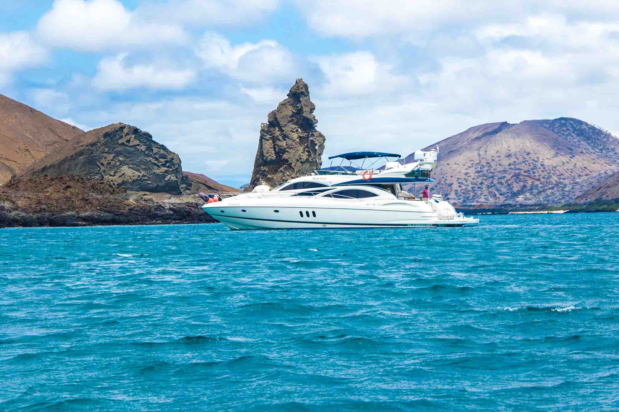 7 Reasons to Add the Galapagos to Your Winter Bucket List Voyagers Travel Specialists Galapagos yacht | Kicker rock