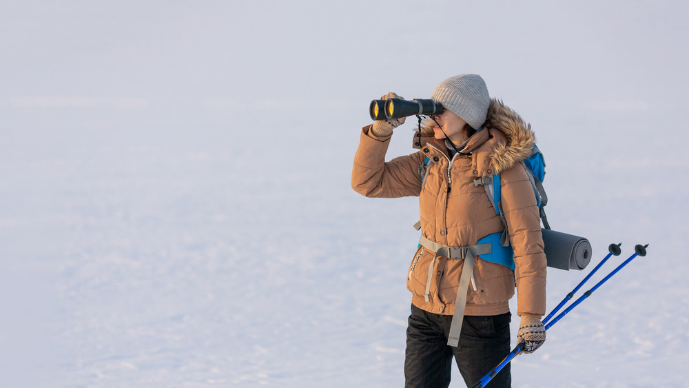 Woman visiting Antarctica with adventure gear