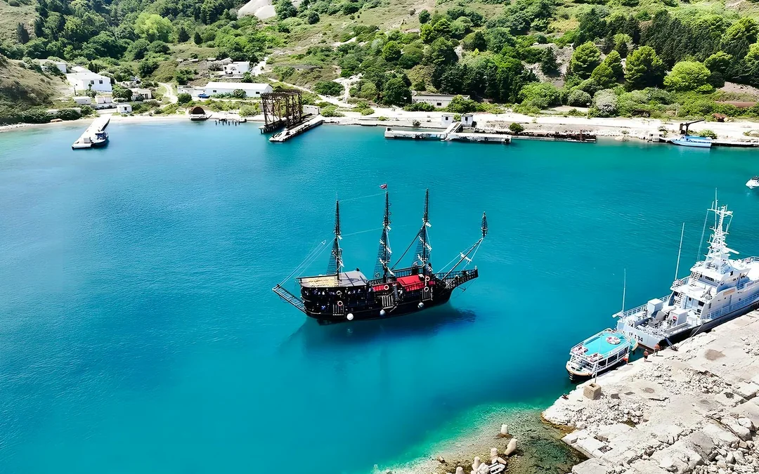 From Vlore: Sazan Island, Haxhi Ali Cave & Karaburun Peninsula Pirate Ship Tour Image 1