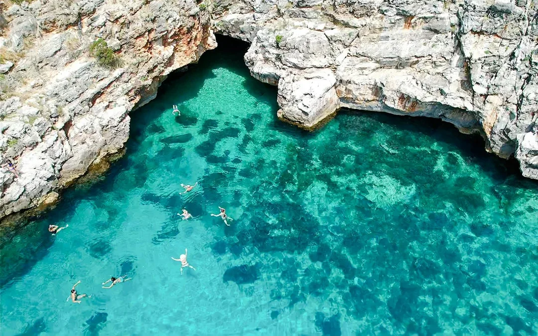 From Vlore: Unknown Escape Party Boat Cruise with Drinks, Music & Secret Swim Stops Image 4