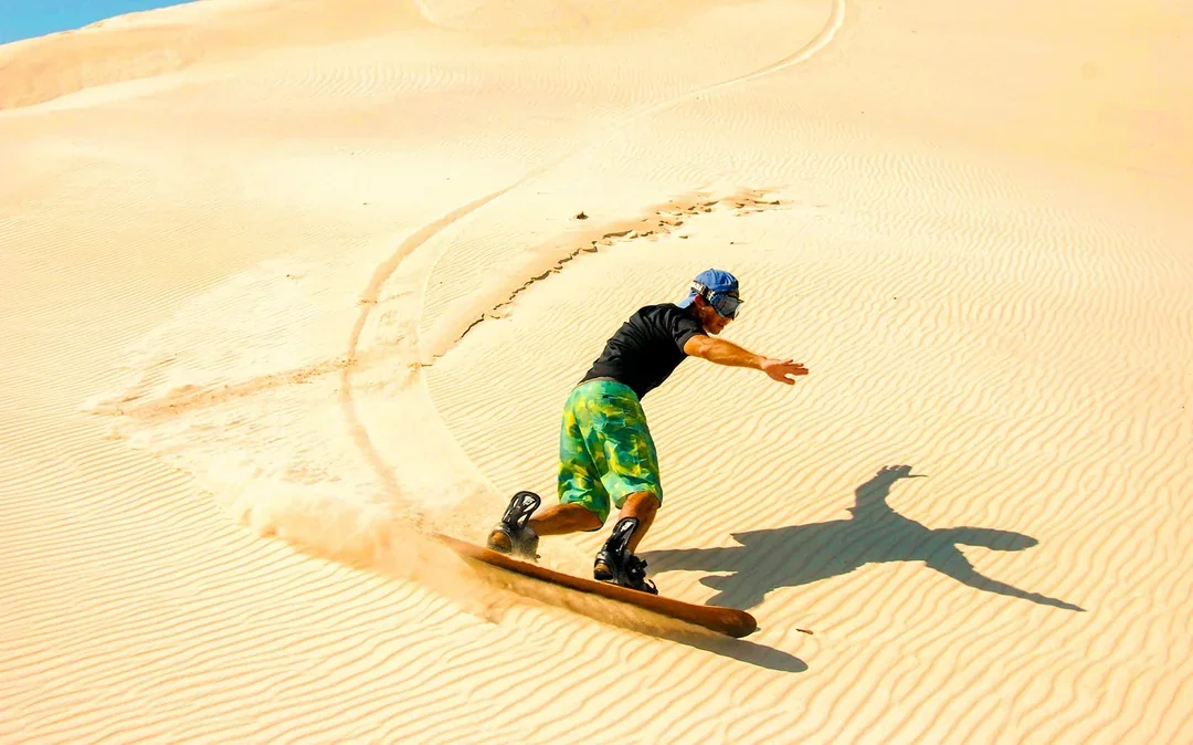 Morning Desert Safari with Camel Farm Visit & Sandboarding Image 4