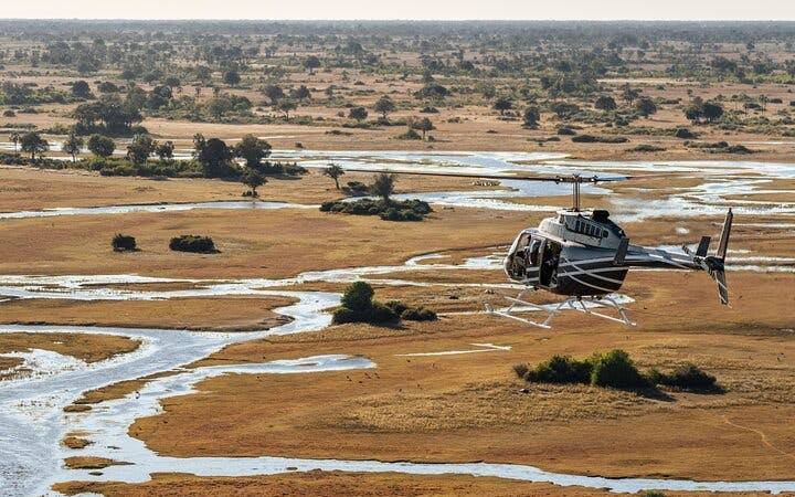 Okavango Delta Doors-Off Helicopter Tour with Champagne Island Stop Image 10