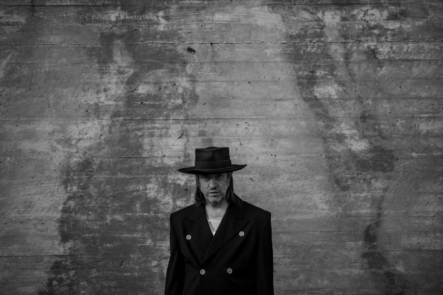 May be a black-and-white image of overcoat