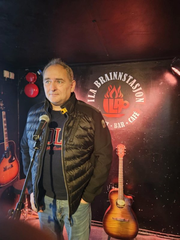 May be an image of dartboard, guitar and text