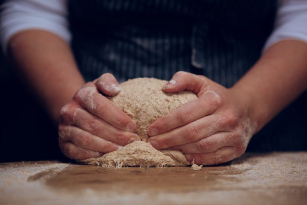 May be an image of 1 person, rye bread and baguette