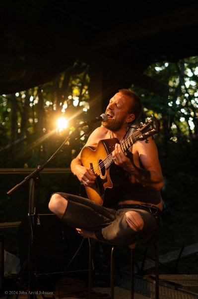 May be an image of guitar and fire